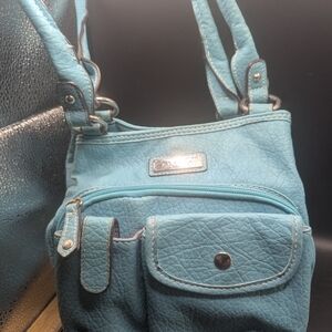 Strada Turquoise Man Made Material With Pink Cloth Interior VGC.